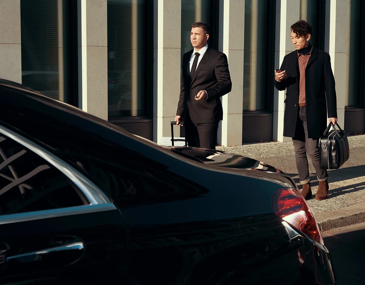 Professional chauffeur service with luxury vehicle